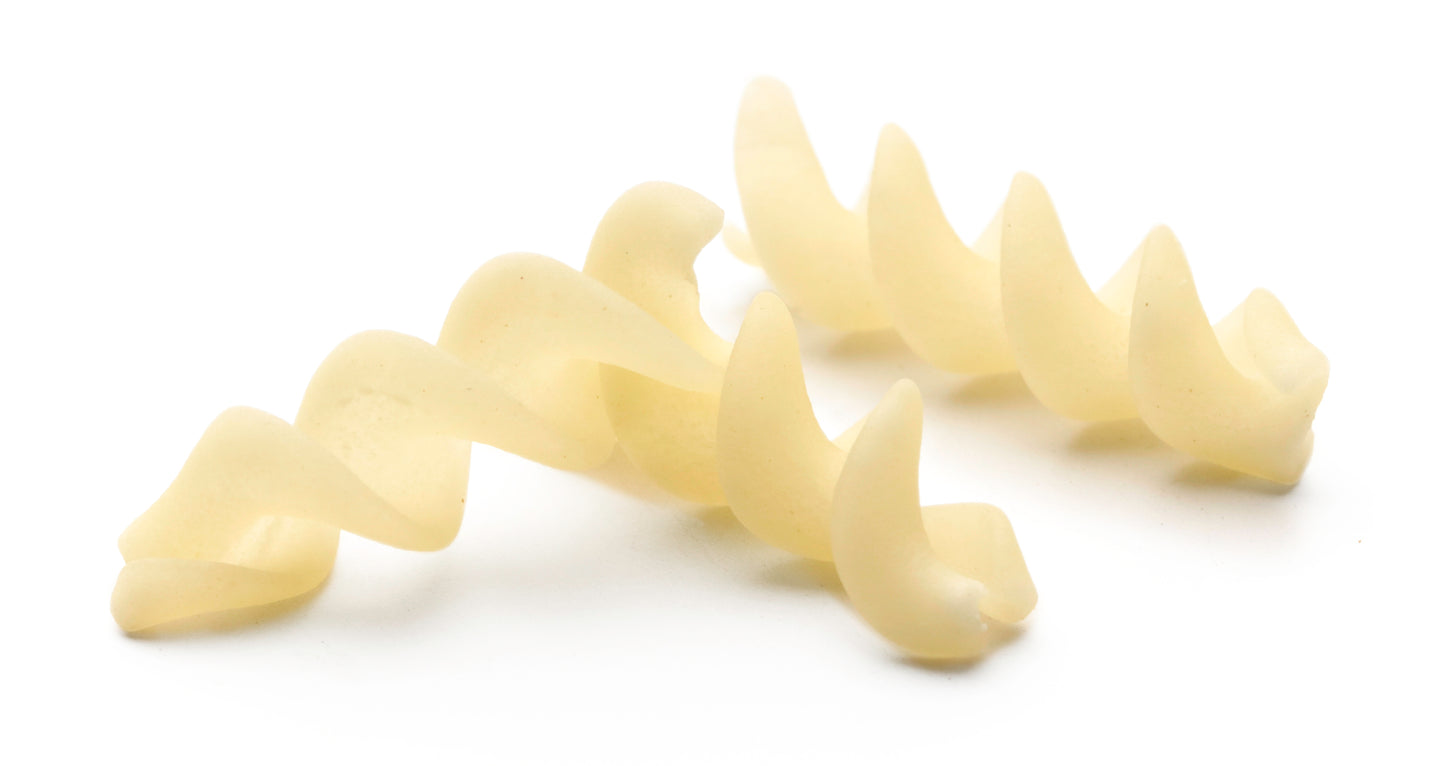 Cereal spiral snack pallets ready to fry on a plate.